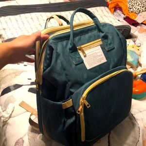 Diaper bag backpack with changing station/bassinet for baby